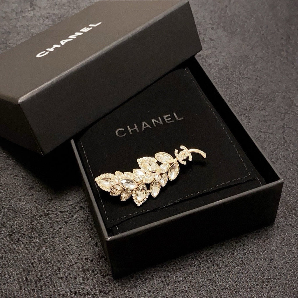logo brooch
